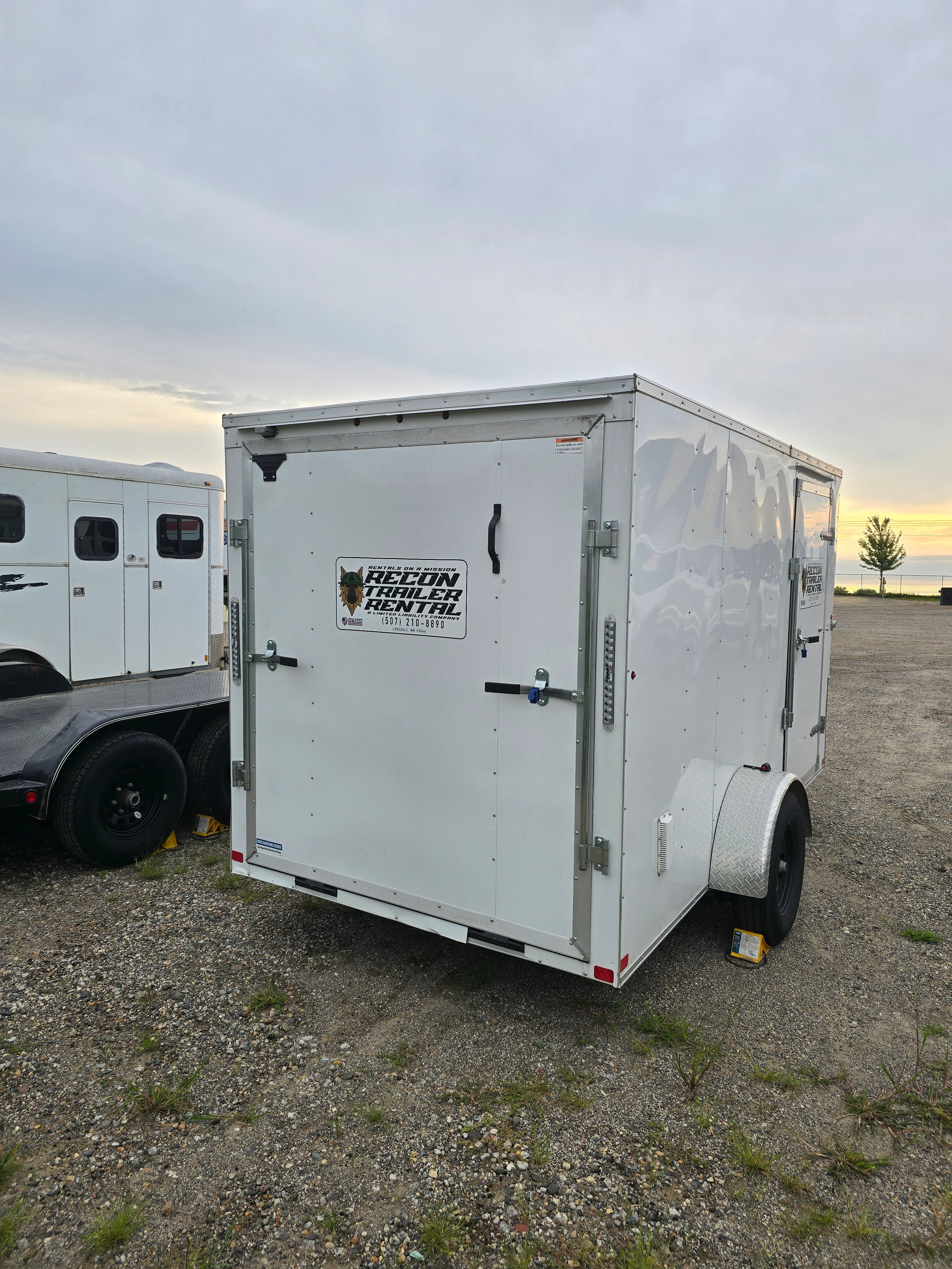 Black enclosed trailer rear view showing weather-protected cargo area