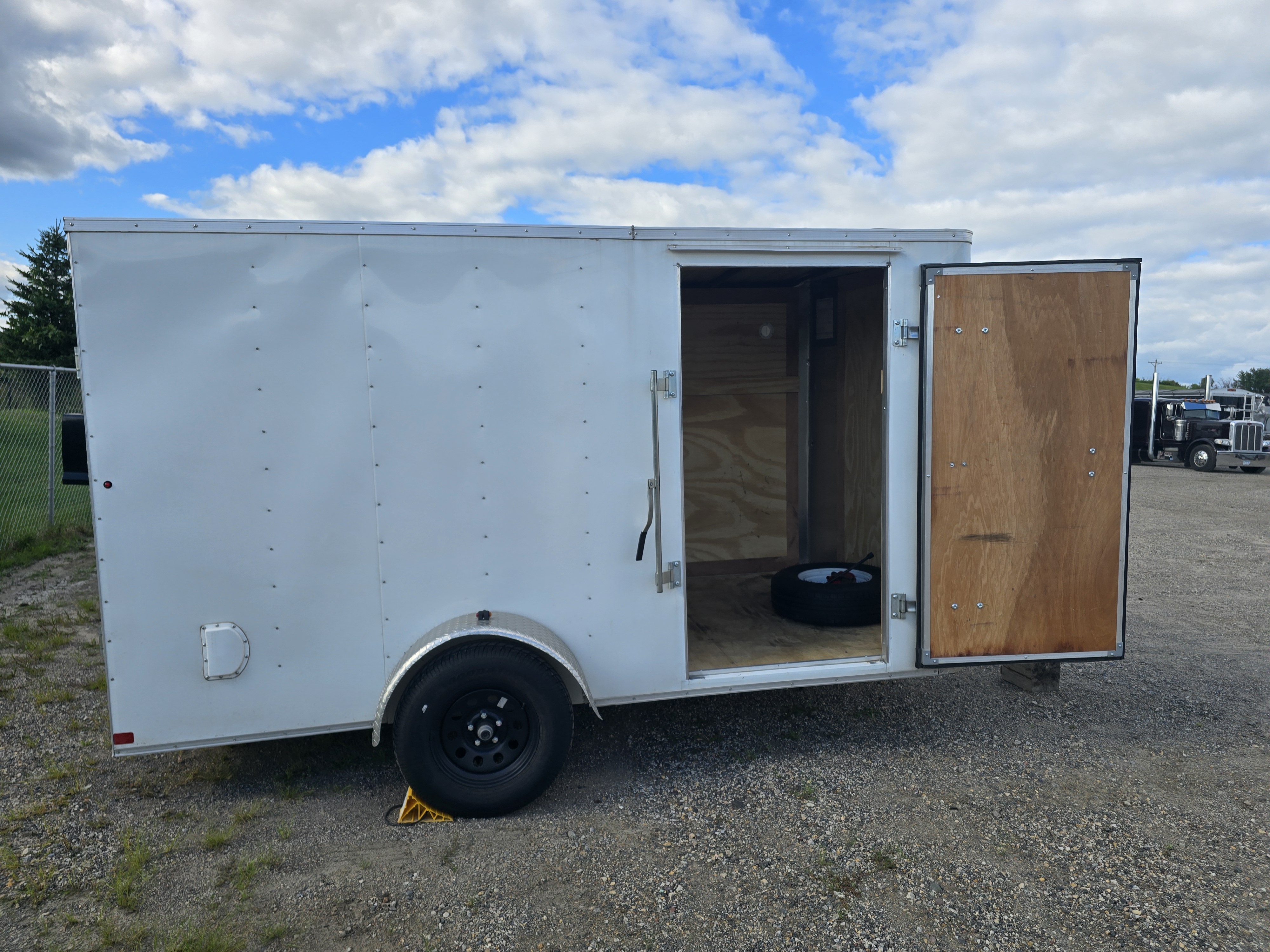 6x12 enclosed cargo trailer with rear doors open showing interior cargo space