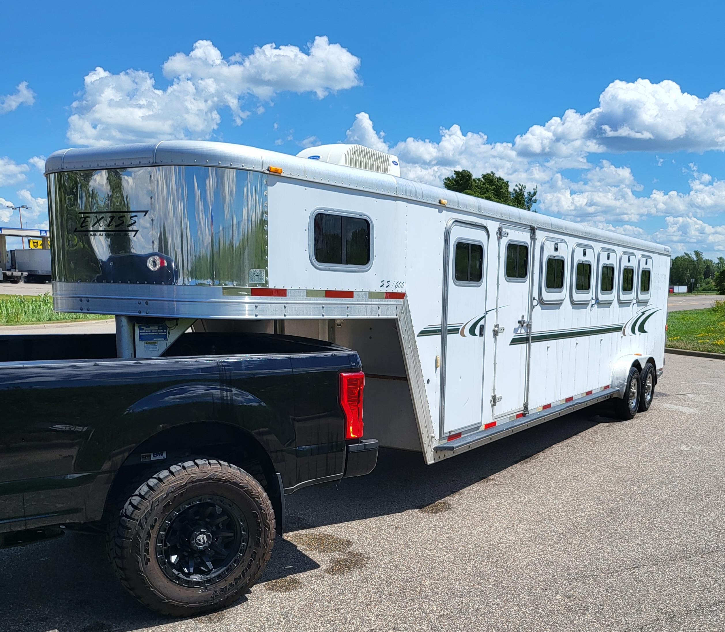 Exiss horse trailer rear view showing horse stall access and ventilation